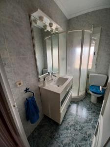 a bathroom with a sink and a toilet and a mirror at Chalet independiente con amplio jardín y barbacoa AT - CC-00678 in Puerto Rey +29 photos