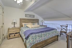 a bedroom with a bed and a table and a chair at Idyllic Sea Pines Villa Walk to the Beach and More! in Hilton Head Island