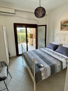 Posteľ alebo postele v izbe v ubytovaní Paralia Pefkohori apartments