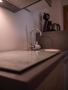 a kitchen counter top with a sink and a sink at Haus am rechten Fleck in Kaunertal