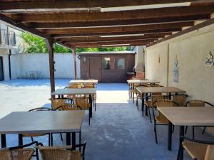 a row of tables and chairs in a building at Casa Sagrada in Eforie Nord
