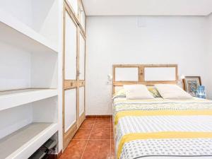 a bedroom with two beds in a room at Apartament 'Es Botànic' in Blanes
