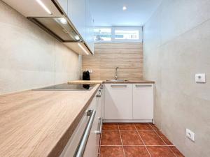 a kitchen with a sink and a counter top at Apartament 'Es Botànic' in Blanes