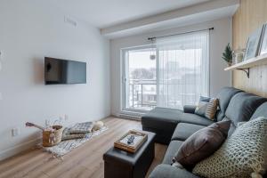 A seating area at The Urban Oasis - Old Quebec - Gym - AC - Indoor Parking