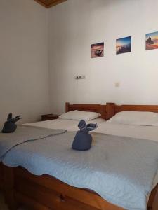 Postel nebo postele na pokoji v ubytování Theo Apartments