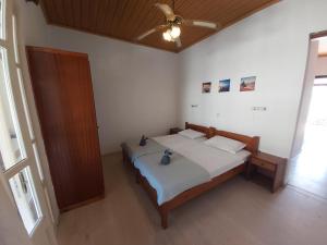 Postel nebo postele na pokoji v ubytování Theo Apartments