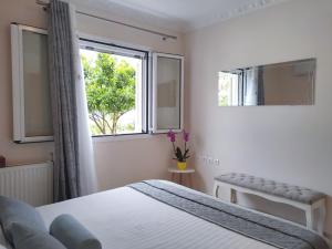 A bed or beds in a room at Blue Lagoon Luxury Apartment G2