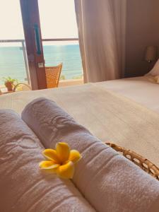 Kama o mga kama sa kuwarto sa Beach Eco Stays Hotel Boutique Lagoinha