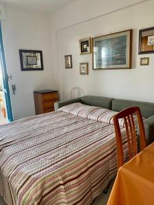 Ένα ή περισσότερα κρεβάτια σε δωμάτιο στο Maison a San Cataldo +4 φωτογραφίες