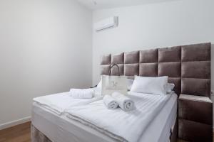 Posteľ alebo postele v izbe v ubytovaní Apartmani Đogaš