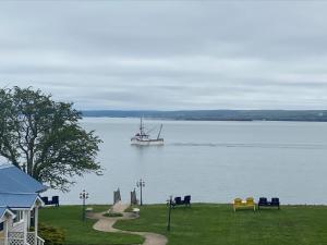 a boat in a large body of water at Seawinds Motel & Suites in Digby +6 photos