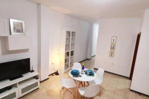 TV a/nebo společenská místnost v ubytování Edificio Melo playa a 150m