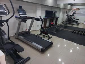 a gym with a treadmill and other exercise equipment at Suites Copérnico Polanco Anzures in Mexico City