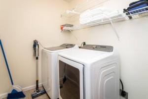 a laundry room with two washing machines in it at Spacious Family Friendly Home Near Massanutten and National Park in McGaheysville +21 photos