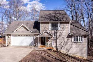 a gray house with a white garage at Spacious Family Friendly Home Near Massanutten and National Park in McGaheysville