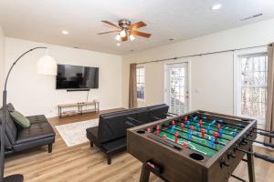 a living room with a pool table at Spacious Family Friendly Home Near Massanutten and National Park in McGaheysville