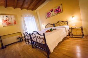 Postel nebo postele na pokoji v ubytování Hotel Alla Corte dei Bicchi
