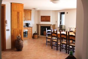 a kitchen and dining room with a table and chairs at Affittacamere Pantaleone in Camerota