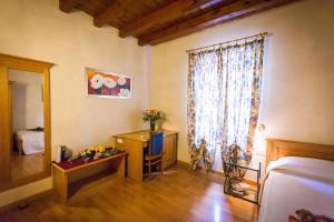 Postel nebo postele na pokoji v ubytování Hotel Alla Corte dei Bicchi