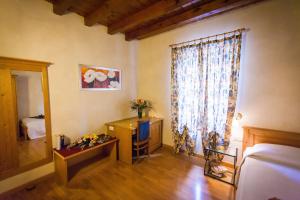 Postel nebo postele na pokoji v ubytování Hotel Alla Corte dei Bicchi