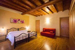Postel nebo postele na pokoji v ubytování Hotel Alla Corte dei Bicchi