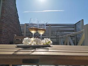 two glasses of wine sitting on a table at 't Poorthof in Borgloon