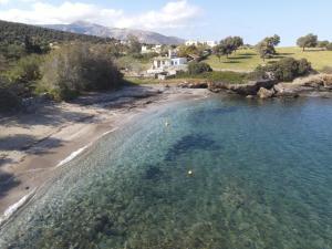 an aerial view of a beach and the ocean at Sarris Ligaridia Apartments in Naxos Chora