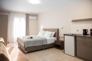 Postel nebo postele na pokoji v ubytování Avyssos Residents
