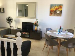 A television and/or entertainment centre at Lovely 2 Bedroom Holiday Apartment in Central Caleta de Fuste