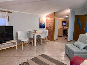 A television and/or entertainment centre at AL CLISI graziosa mansarda