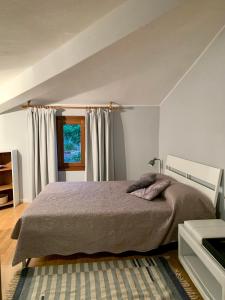 A bed or beds in a room at AL CLISI graziosa mansarda