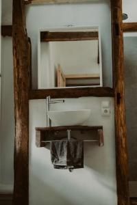 a bathroom with a sink and a mirror at Modernisiertes Fachwerkhaus in Rheinbach bei Bonn in Rheinbach