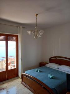 Posteľ alebo postele v izbe v ubytovaní Casa vacanze Blu Taormina