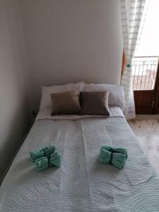 Posteľ alebo postele v izbe v ubytovaní Casa vacanze Blu Taormina