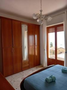 Posteľ alebo postele v izbe v ubytovaní Casa vacanze Blu Taormina
