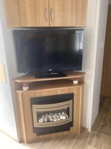 a fireplace with a flat screen tv on top of it at The Pet Friendly Pad in Hunstanton