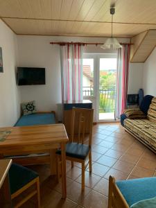 a living room with a table and a couch at Fala in Karwia