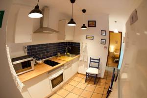 Kuchyň nebo kuchyňský kout v ubytování Apartamento tranquilo e ideal para parejas, con bonitas vistas de Toledo y fantàstica ubicación