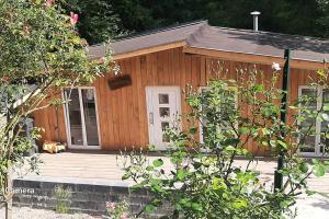 a small wooden house with a porch at Lalas'house in Philippeville