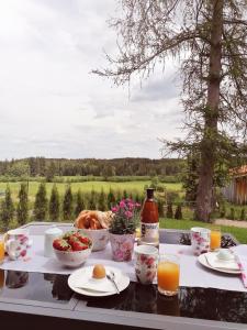 a breakfast table with a view of a field at Ferienwohnung Bauer in Böbing