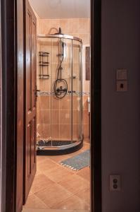a walk in shower in a bathroom with a tile floor at "Моето Любимо Място", Смолянски езера - "My Favorite Place", Smolyan lakes in Smolyan