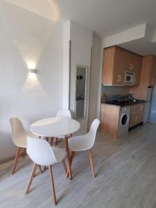 a kitchen with a table and chairs in a room at Benal Beach 229 in Benalmádena