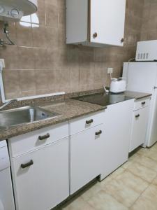 A kitchen or kitchenette at CASA PORTELA APARTAMENTOS
