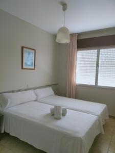 Postel nebo postele na pokoji v ubytování CASA PORTELA APARTAMENTOS