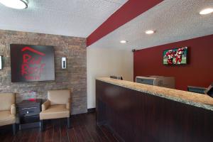 a bar in a waiting room with a red rock motel sign at Red Roof Inn Springfield, IL in Springfield