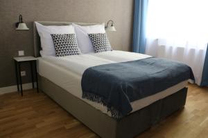Łóżko lub łóżka w pokoju w obiekcie Apartament Żeromskiego 17 - Insel Apartamenty