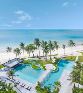 an aerial view of a resort with a swimming pool and the beach at Centara Reserve Samui - SHA Plus in Chaweng