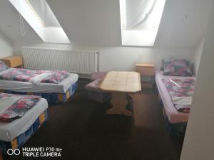 Posteľ alebo postele v izbe v ubytovaní Penzion U Hladů