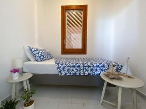 Postel nebo postele na pokoji v ubytování Jerry Beach house