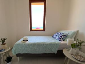 Postel nebo postele na pokoji v ubytování Jerry Beach house